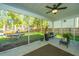 Spacious screened porch overlooking the backyard with ceiling fan and potted plants at 154 Pecan Dr, Summerville, SC 29483
