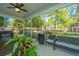 Relaxing screened porch with ceiling fan, wicker furniture, and backyard view at 154 Pecan Dr, Summerville, SC 29483