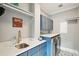 Laundry room with blue cabinets, quartz countertops, and shelving at 1609 Sewee Fort Rd, Mount Pleasant, SC 29466