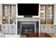 Living room fireplace with built-in shelving at 1609 Sewee Fort Rd, Mount Pleasant, SC 29466