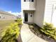 Well-maintained house exterior, featuring a black front door and manicured landscaping at 498 Lake Ridge Blvd, Summerville, SC 29486