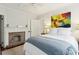 Bedroom with brick fireplace and white bedding at 74 Vanderhorst St, Charleston, SC 29403