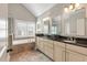 Elegant bathroom with double vanity, soaking tub, and separate shower at 8586 Refuge Point Cir, North Charleston, SC 29420
