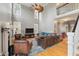Two-story living room with hardwood floors and a fireplace at 8586 Refuge Point Cir, North Charleston, SC 29420