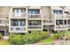 Ground level view of the property's exterior, highlighting the balcony at 1331 Pelican Watch Villas, Seabrook Island, SC 29455