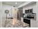 Modern kitchen with stainless steel appliances and granite countertops at 1331 Pelican Watch Villas, Seabrook Island, SC 29455