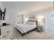 King bedroom with TV, white dresser and access to private patio at 1331 Pelican Watch Villas, Seabrook Island, SC 29455