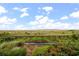 Landscaped backyard with boardwalk path and marsh views at 1331 Pelican Watch Villas, Seabrook Island, SC 29455