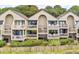 Ground level view of the property's exterior, highlighting the balcony at 1331 Pelican Watch Villas, Seabrook Island, SC 29455