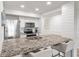 Modern kitchen with granite countertops, stainless steel appliances, and breakfast bar at 1331 Pelican Watch Villas, Seabrook Island, SC 29455
