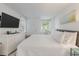 Bright bedroom with king-size bed and white dresser at 1331 Pelican Watch Villas, Seabrook Island, SC 29455