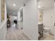 Bright entryway with hardwood floors, leading to living area and half bathroom at 1331 Pelican Watch Villas, Seabrook Island, SC 29455
