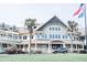 Two-story clubhouse with large windows, a covered porch, and a gray SUV at 1331 Pelican Watch Villas, Seabrook Island, SC 29455