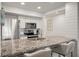 Modern kitchen with granite countertops, stainless steel appliances, and breakfast bar at 1331 Pelican Watch Villas, Seabrook Island, SC 29455