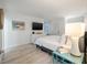 Bedroom with king bed, blue nightstand, and large window at 1331 Pelican Watch Villas, Seabrook Island, SC 29455