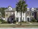 Two-story brick townhouse with a palm tree and a landscaped yard at 752 Certificate Ct, Charleston, SC 29414