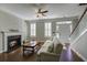 Living room with fireplace, built-in shelves, hardwood floors, and a comfy sofa at 752 Certificate Ct, Charleston, SC 29414