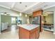 Open concept kitchen features granite countertops and island, looking into the living room at 4966 Ballantine Drive, Summerville, SC 29485