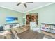 Relaxing living room with hardwood floors and views of the kitchen and backyard at 4966 Ballantine Drive, Summerville, SC 29485