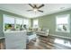 Comfortable living room featuring hardwood floors and large windows at 4966 Ballantine Drive, Summerville, SC 29485