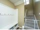 Stairwell with built-in bench and hooks, plus a baby gate at 4966 Ballantine Drive, Summerville, SC 29485
