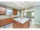 Bright kitchen with granite island, stainless steel appliances, and view into living area at 4966 Ballantine Drive, Summerville, SC 29485