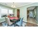 Charming dining area with dark wood table, colorful chairs, and natural light at 4966 Ballantine Drive, Summerville, SC 29485