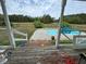 View from porch to kidney shaped pool at 204 Charles St, Saint George, SC 29477