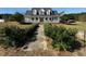Two story home with wrap around porch and landscaped yard at 204 Charles St, Saint George, SC 29477