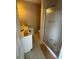 Bathroom with shower, toilet and vanity; in need of updating at 204 Charles St, Saint George, SC 29477