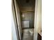 Bathroom with shower, toilet, and white vanity; needs updating at 204 Charles St, Saint George, SC 29477