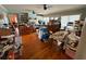 Spacious living room with hardwood floors and access to patio; is cluttered with boxes at 204 Charles St, Saint George, SC 29477