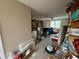 Large bedroom with wood floors, ceiling fan, and large windows; is cluttered at 204 Charles St, Saint George, SC 29477