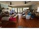 Living room with hardwood floors, fireplace, and access to patio; is cluttered with boxes at 204 Charles St, Saint George, SC 29477