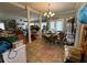 Large dining room with tile floor and columns separating it from other rooms; is cluttered at 204 Charles St, Saint George, SC 29477