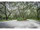 Circular drive entrance surrounded by lush landscaping at 60 Fenwick Hall Allee # 933, Johns Island, SC 29455