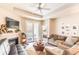 Living room with fireplace, balcony access, and view of bedroom at 60 Fenwick Hall Allee # 933, Johns Island, SC 29455