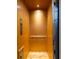 Simple, clean interior of a wood elevator at 362 Pelican Flight Dr, Dewees Island, SC 29451