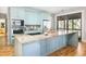 Modern kitchen featuring light blue cabinetry, granite countertops, and stainless steel appliances at 362 Pelican Flight Dr, Dewees Island, SC 29451