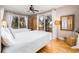 Bedroom with two twin beds, hardwood floors and access to balcony at 362 Pelican Flight Dr, Dewees Island, SC 29451