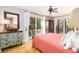 Bedroom with two twin beds, hardwood floors and access to balcony at 362 Pelican Flight Dr, Dewees Island, SC 29451