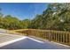 Private deck overlooking lush trees, perfect for enjoying the outdoors at 362 Pelican Flight Dr, Dewees Island, SC 29451