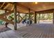 Covered deck area with golf cart storage at 362 Pelican Flight Dr, Dewees Island, SC 29451