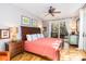 Bedroom with queen bed, hardwood floors and access to balcony at 362 Pelican Flight Dr, Dewees Island, SC 29451