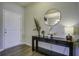 Bright entryway with console table, mirror, and lamp at 415 Snowy Plover Ln, Summerville, SC 29486