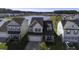 Aerial view of houses with lake in community at 415 Snowy Plover Ln, Summerville, SC 29486