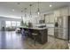 Modern kitchen with granite island, stainless steel appliances, and hardwood floors at 415 Snowy Plover Ln, Summerville, SC 29486