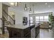 Kitchen with large island, granite countertops, and stainless steel appliances at 415 Snowy Plover Ln, Summerville, SC 29486
