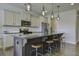 Modern kitchen with granite island, stainless steel appliances, and hardwood floors at 415 Snowy Plover Ln, Summerville, SC 29486