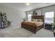 Spacious bedroom with carpeted floor, large bed and window views at 415 Snowy Plover Ln, Summerville, SC 29486
